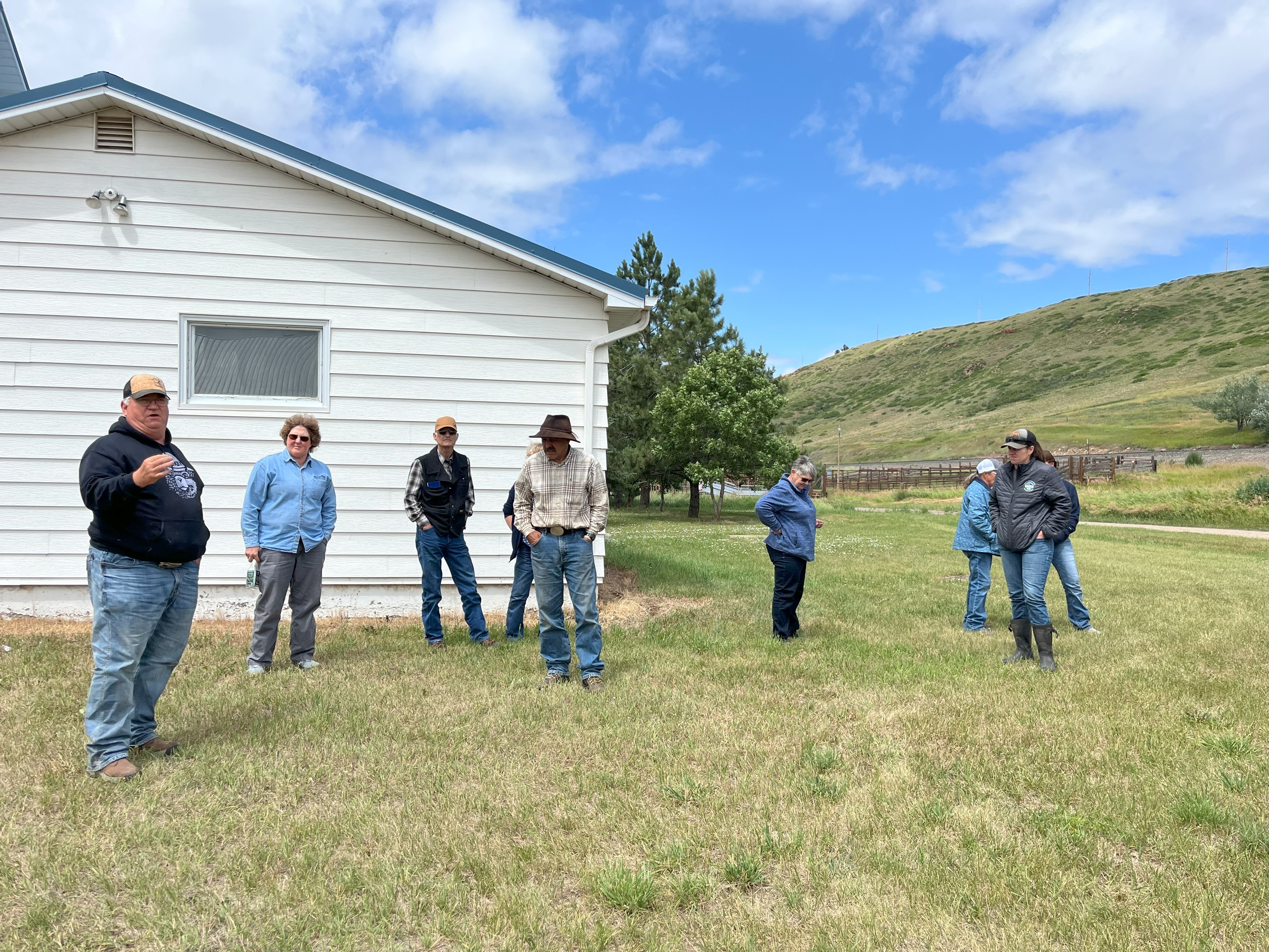Participants examine Eastern Heath Snails found near the Raynesford Community Center.